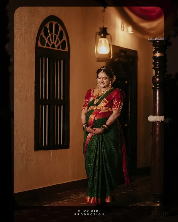 This is a beautifully lit portrait of the mother-to-be, capturing a quiet moment of reflection during her Seemantha ceremony. I used the traditional home's warm lighting to create a cinematic and timeless feel, highlighting her joy and anticipation.