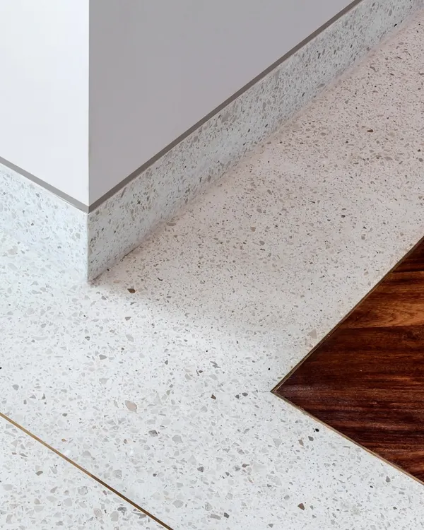 A detail of the flooring in the Terrazzo Residence. We love using cast-in-situ terrazzo with brass dividers, which creates a seamless, durable, and visually interesting surface that feels wonderful underfoot.