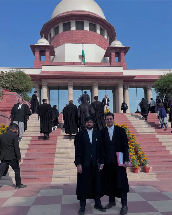 On the steps of the Supreme Court of India with a colleague. Practicing here is a privilege and a responsibility we take very seriously.
