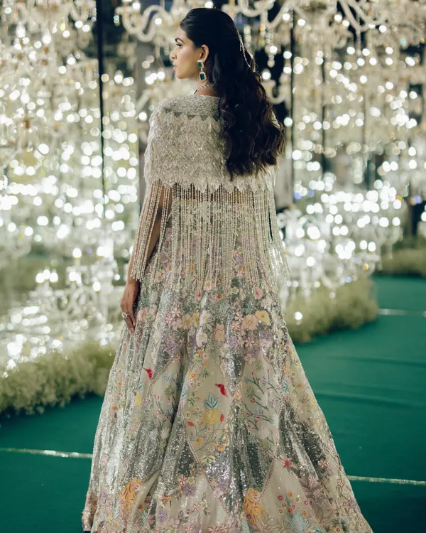 This Rahul Mishra lehenga was a dream to style for my client's sangeet. The intricate floral embroidery and the stunning beaded cape made her look absolutely radiant on the dance floor.