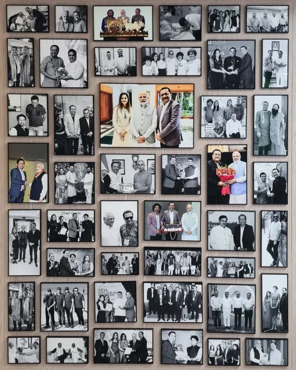 A closer look at the impressive 45-photo gallery wall we created for Kiran Gems. Each photograph is perfectly aligned and spaced, creating a seamless and powerful visual timeline of the company's history and achievements.