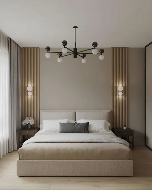 This serene bedroom is designed for ultimate relaxation. I used a neutral color palette, soft fabrics, and a statement chandelier to create a calm and sophisticated retreat. The wood-paneled accent wall adds warmth and texture.