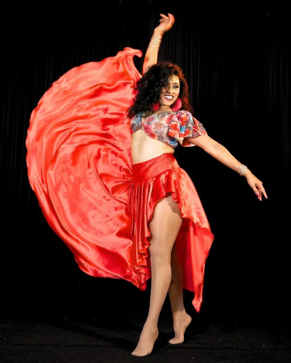 This is the feeling I want to share with you. The pure joy of letting go and moving to the music. This photo captures the energy and passion that I bring to every single class and performance.