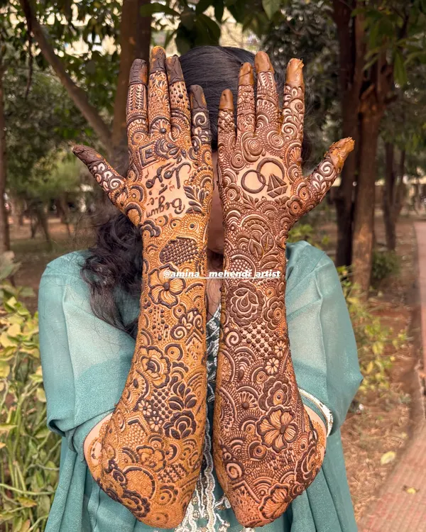 This is my signature full-arm mehendi style. I love filling the hands and arms with dense, detailed Pakistani-style patterns, including intricate florals, leaves, and checkerboard fillers for a rich and festive look.