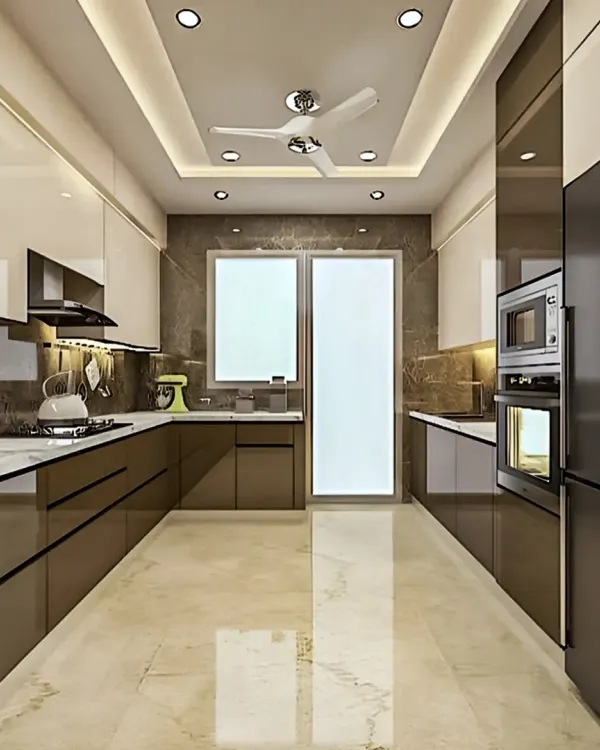 A spacious and luxurious parallel kitchen featuring high-gloss brown cabinets and a marble-finish floor. The design includes integrated appliances, a false ceiling with recessed lighting, and ample counter space, making it a perfect example of a high-end kitchen renovation.