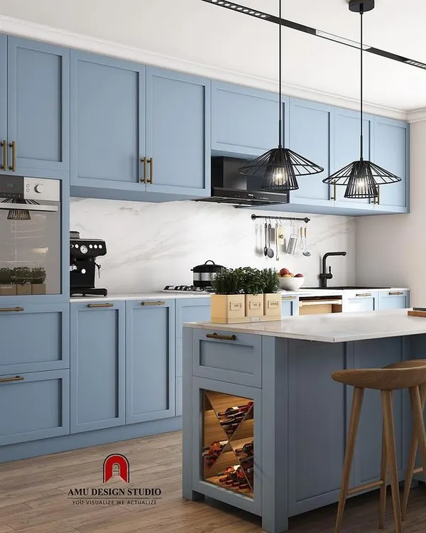 A proposed design for a spacious kitchen in a beautiful powder blue. This concept includes an island with a breakfast counter, a dedicated pantry unit, and built-in appliances for a seamless look.