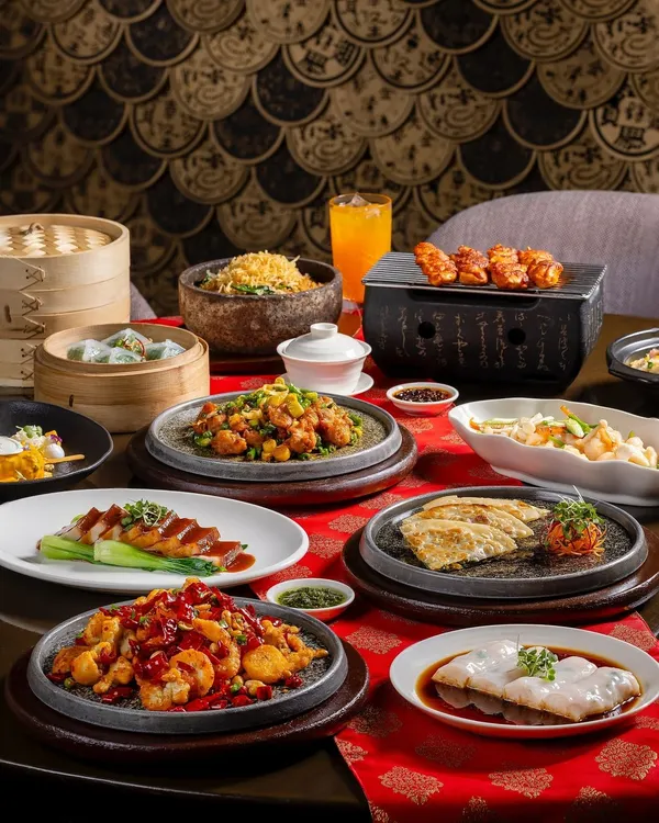 A cover shot for the new menu at Shang Palace, Shangri-La Eros Delhi. This elaborate spread showcases a wide variety of their offerings, including dim sum and sizzling plates.