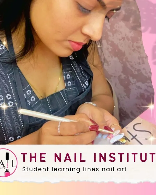 Straight, clean lines are harder than they look. This student is practicing her line work, a foundational skill for many nail art designs.