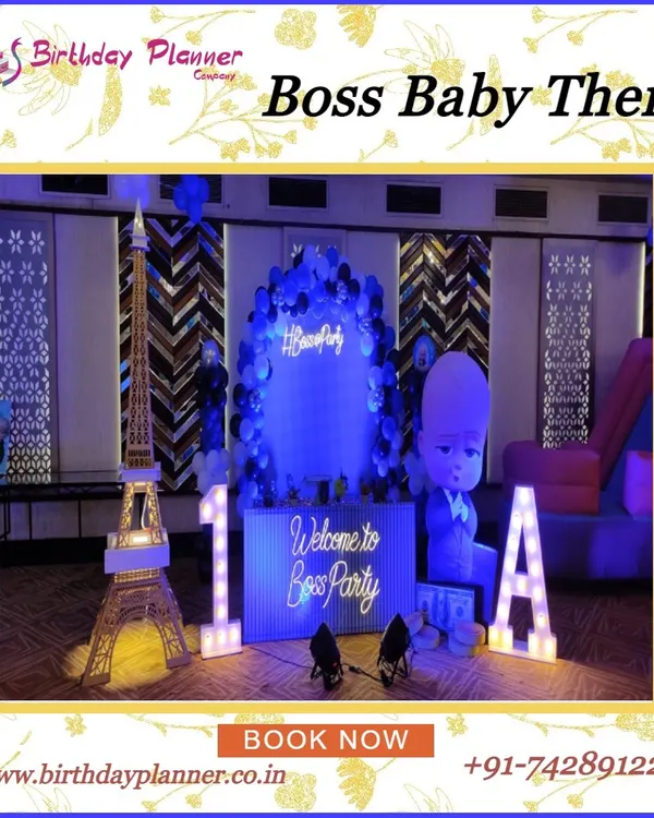 A stylish Boss Baby theme party featuring a cool blue lighting scheme. The setup includes a life-size character cutout, marquee letters, a miniature Eiffel Tower prop, and a custom "Welcome to the Boss Party" sign.