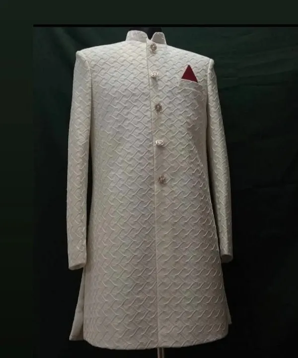 A classic off-white sherwani, perfect for a groom. I focus on getting the details right, from the intricate self-patterned fabric to the structured, clean tailoring that guarantees a royal look.