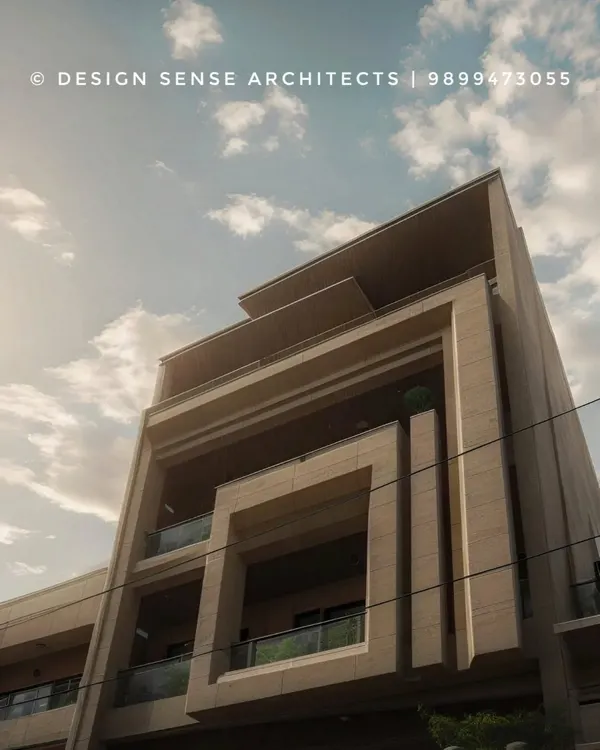 An upward view of a residential building we designed, showcasing its strong geometric lines and modern form. The play of solid and void creates a dynamic facade that changes with the light and shadows throughout the day.