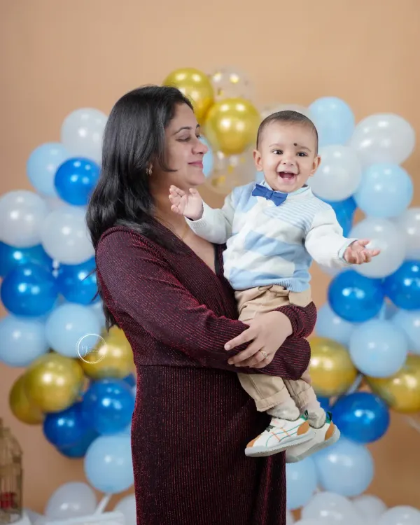 A mother's love and a baby's laughter. This candid moment during a family portrait session is absolutely priceless.