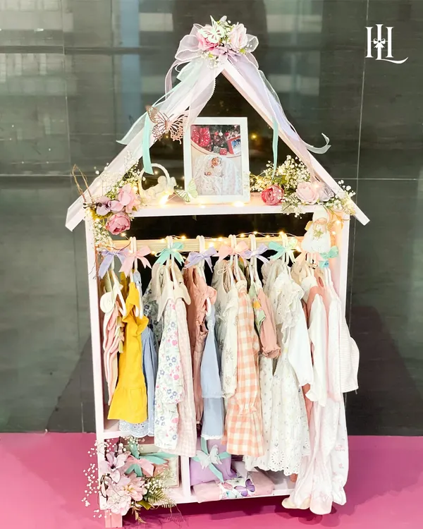 This 'Home of Love' hamper is one of my proudest creations, featuring a miniature wardrobe filled with adorable, handpicked outfits for a new baby girl. It’s more than a gift; it’s a keepsake wardrobe to celebrate her homecoming in style.