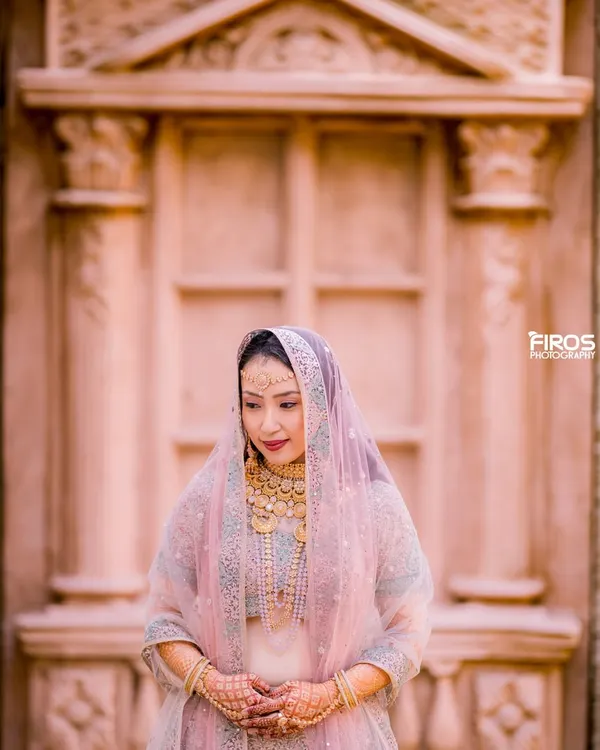 A beautiful, serene portrait of a bride-to-be in her traditional attire. The soft light and her gentle expression perfectly capture the anticipation and grace of this special time.