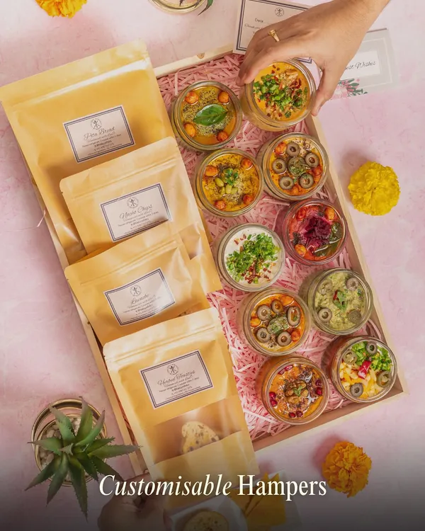 This is where it all comes together. A large, customisable hamper filled with an assortment of our signature dips and multiple packets of artisanal crackers, perfect for a grand gesture or a corporate gift.