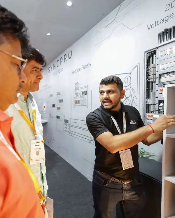 Here is one of our experts at the Smart Home Expo, explaining the intricacies of a SyncPro bedside panel and static voltage stabilizer. We love sharing our knowledge and helping clients understand the technology that powers their homes.