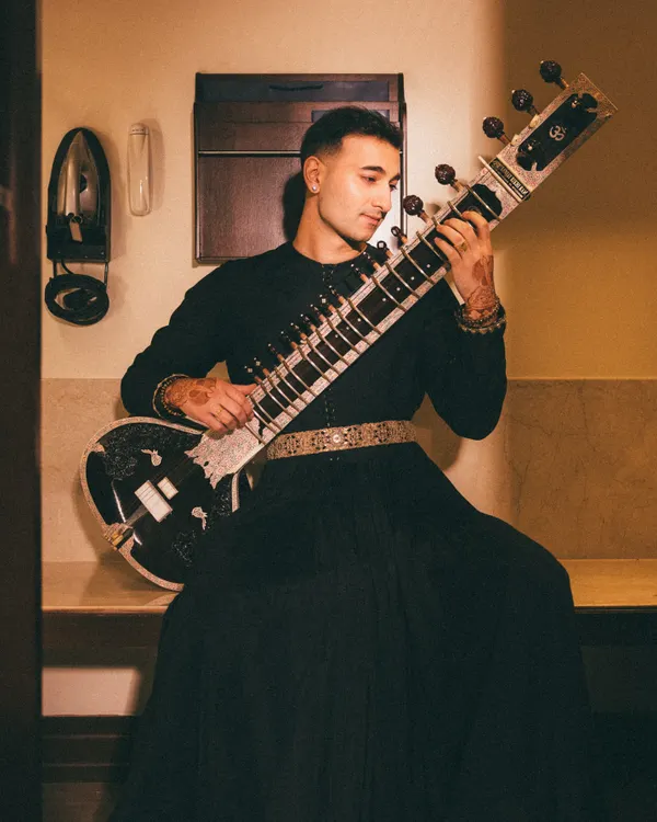 A portrait embodying my 'Sitar Sorcerer' persona. This look, in a custom Torani outfit, captures the magic and mystery I aim to bring to my music.