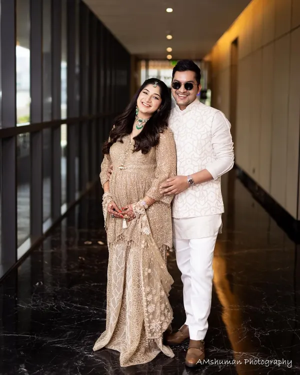 A beautiful portrait of the happy couple during their maternity celebration. Her makeup is soft and glowing, perfect for the occasion.