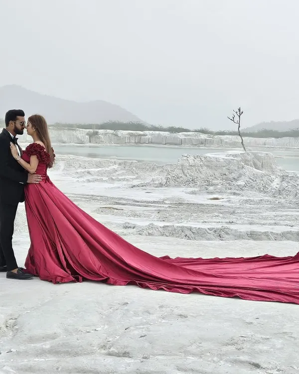 This is the shot that stops the scroll. Our dramatic crimson trail gown is engineered for those epic, wind-blown pre-wedding and fashion photoshoots. It's a hero piece that guarantees your clients feel extraordinary and your portfolio looks world-class.