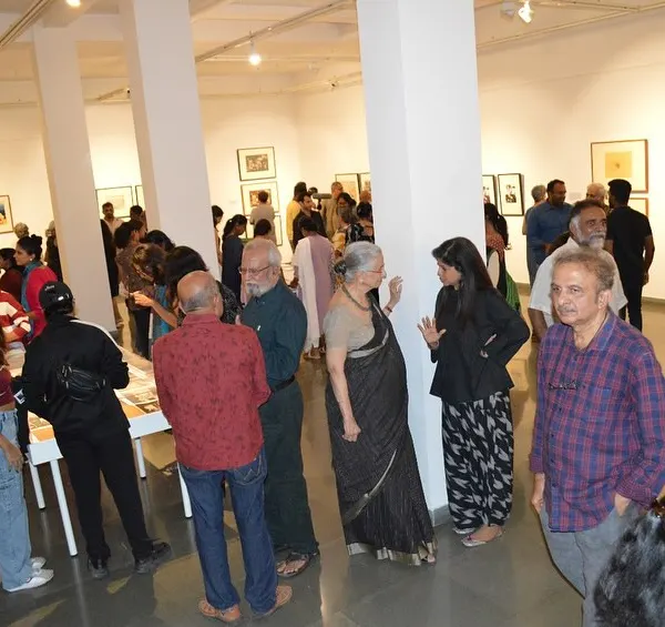 A wide shot of the bustling preview night for Gulammohammed Sheikh's 'Hand Prints'. My goal is to create a space where people feel welcome to gather, talk, and celebrate art.