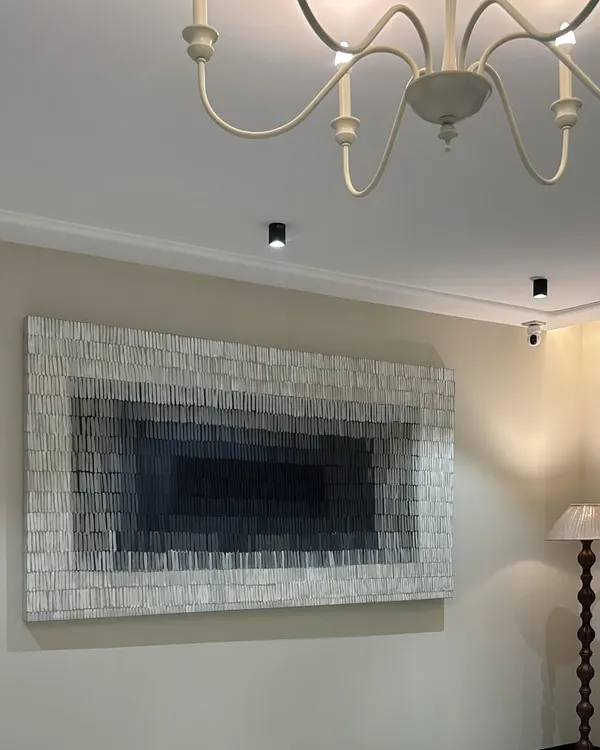 This is the 8ft x 4ft textured gradient piece installed in a client's home in Gujarat. The monochromatic palette and repetitive texture create a mesmerizing and calming effect, perfect for a living room.