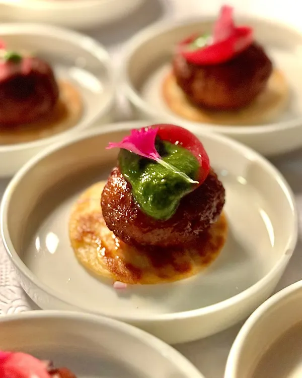 Our signature Lamb Galouti Kebab. This melt-in-your-mouth delicacy is a modern tribute to the royal kitchens of Awadh, and a must-try at our events.