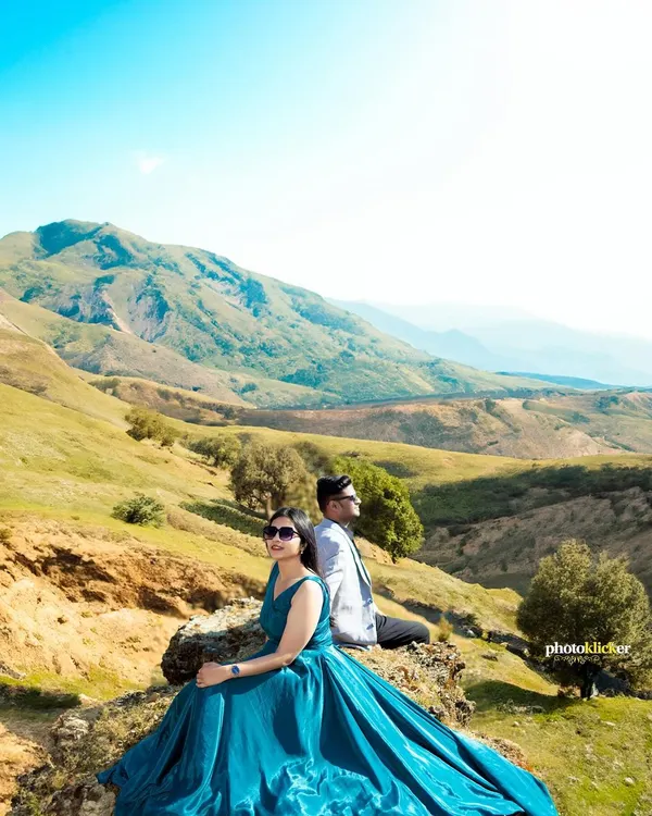A majestic pre-wedding portrait set against the rolling hills of Mussoorie. We use grand landscapes to create epic, breathtaking images for our couples.