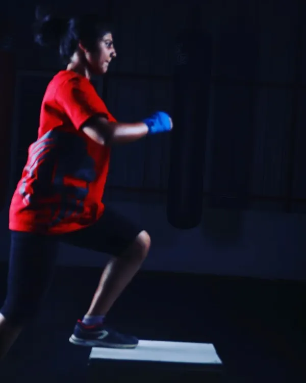 A member performs a step-up, a foundational exercise in our conditioning programs to build lower body strength and cardiovascular endurance.