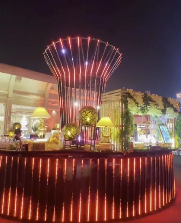 This is how I transform a space. This custom-designed circular bar with integrated lighting became the stunning centerpiece for a large outdoor cocktail event, proving that a mobile bar can be a major design feature.