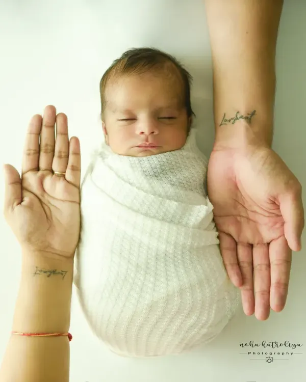This iconic shot, with the parents' hands cradling their newborn, is a powerful symbol of family and protection. It's a simple, clean, and profoundly emotional portrait that I love creating.