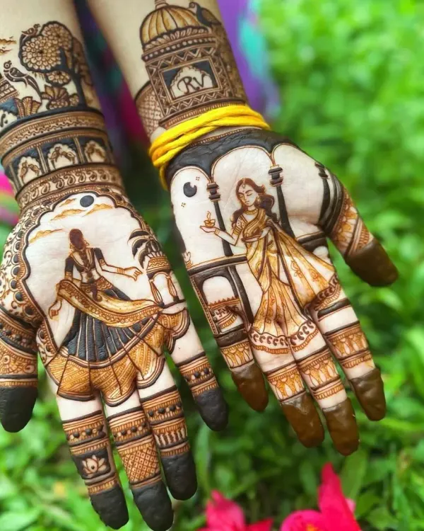 This design captures the essence of celebration. On one palm, a woman holds a traditional diya, while the other features a dancing couple, telling a story of love and festivity. The detailed figures and shaded background bring the entire scene to life.