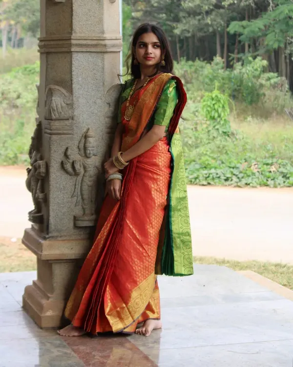 This is the result I aim for with every drape. A classic South Indian silk saree, draped to perfection for a flawless, elegant look that lasts all day. This is ideal for weddings, receptions, or important photoshoots.