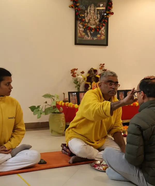 I perform the initiation ceremony, or Diksha, for a new student in our Yoga Teachers' Training Course. This ritual marks the formal beginning of their journey within our Guru-Sishya tradition.