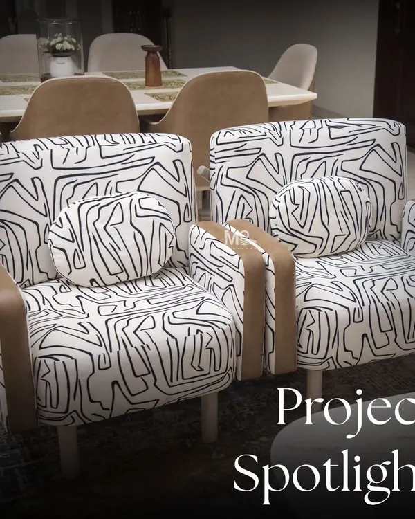 Project Spotlight: The Zaildar Residence. This living room embraces an abstract theme, featuring our custom armchair upholstered in a bold black-and-white fabric that adds a playful yet elegant touch to the space.