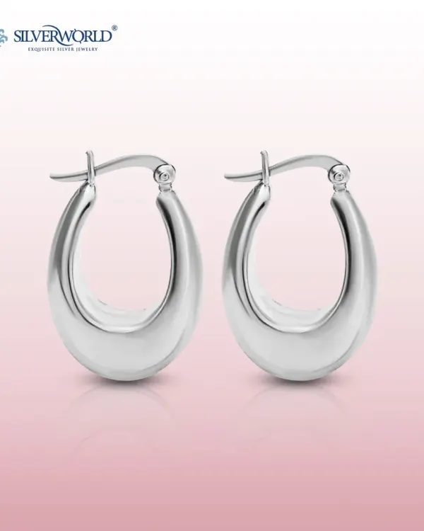 These classic U-shaped silver hoops are a modern wardrobe essential. Their high-polish finish and solid feel make them a versatile choice for any occasion.