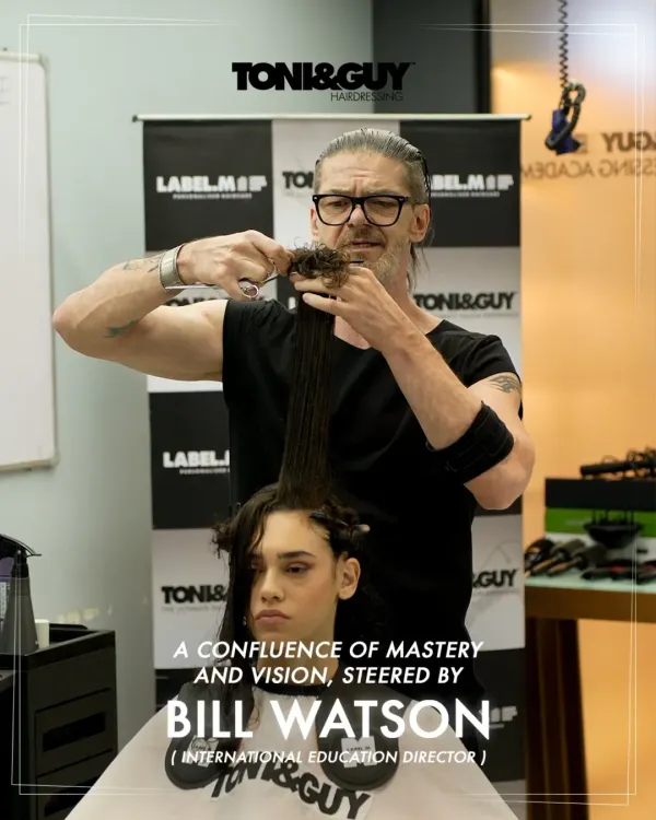 This is the essence of our teaching philosophy: mastery in action. Here, International Education Director Bill Watson demonstrates a precision cutting technique, showing the level of artistry and detail that we instill in every student at our hairdressing academy.