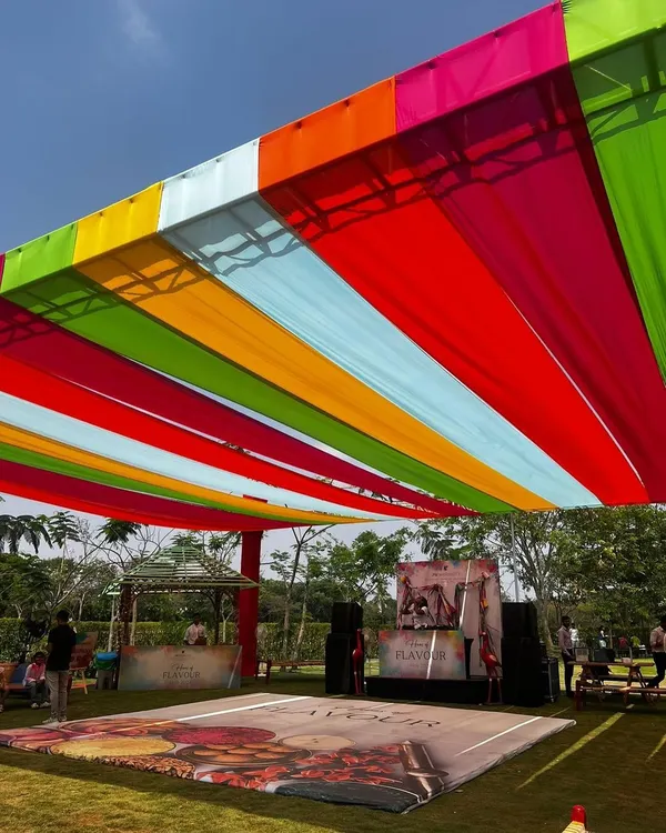 A vibrant canopy of colorful drapes set the stage for a massive Holi celebration at the JW Marriott Golfshire.
