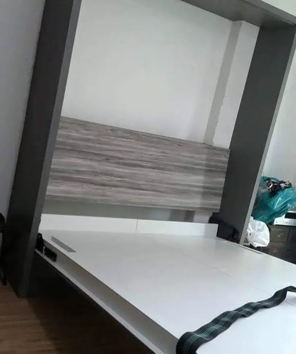 This is how I turn one room into two. A custom wall-mounted Murphy bed, shown here as it unfolds, provides a comfortable sleeping space at night and folds away to maximize your living area during the day.
