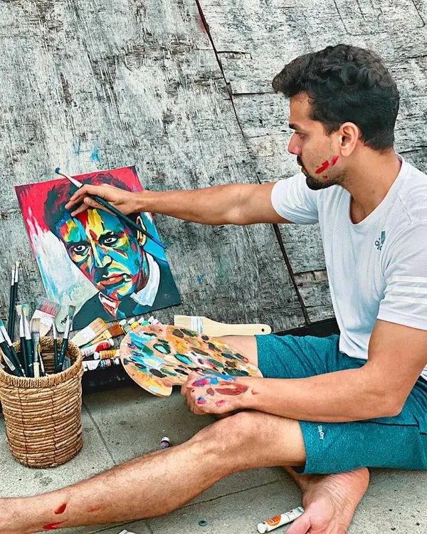 Here I am getting lost in the process of painting a colorful portrait. You can see the focus and joy that comes with applying paint to canvas, a feeling I hope to share with every student in my art classes.
