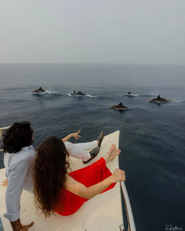 A truly once-in-a-lifetime moment. We captured this couple on a private boat in the serene waters of Lakshadweep as a pod of dolphins swam alongside them, creating a memory as magical as their story. This is the kind of adventure we love to document.