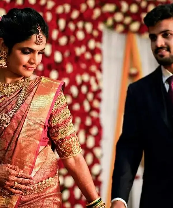 A candid moment from a wedding I worked on. You can see how the rich Kanjeevaram saree, heavy gold jewelry, and soft glam makeup come together for the final reception look.