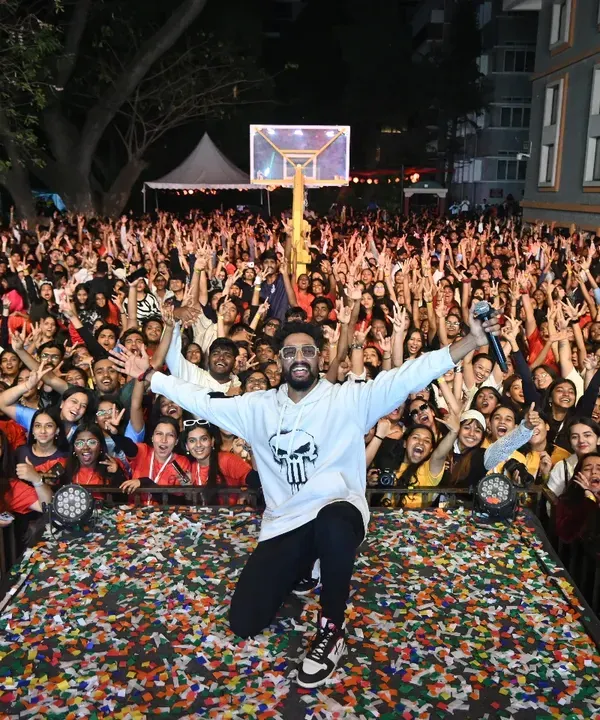 This is the energy I live for. Commanding the stage and feeling the roar of thousands of people at a massive college fest is an unmatched experience. This is the madness I bring.