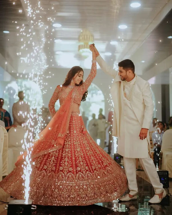 This is the moment. The world fades away, and under a shower of sparks, it's just the two of you, dancing into forever. I live to capture this cinematic magic, the grand celebration of your love story.