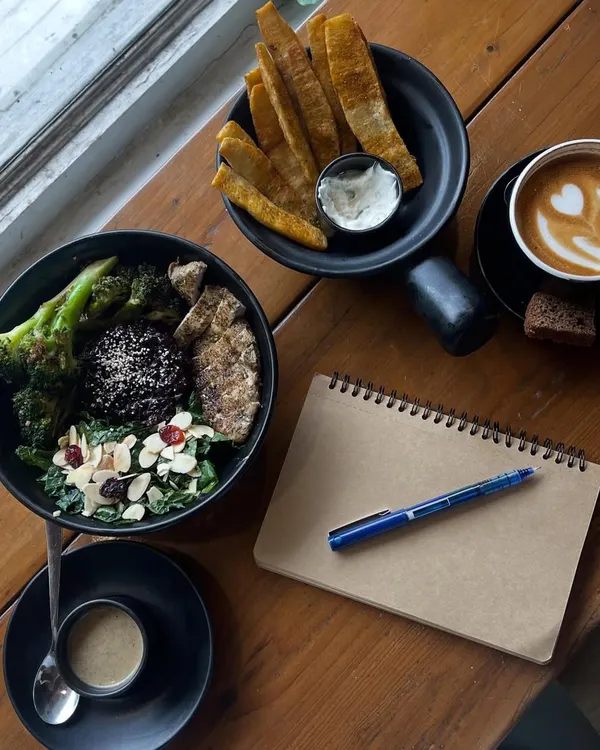 A perfect setup for a productive and mindful afternoon. A nourishing black rice bowl, a warm coffee, and a journal for my thoughts and ideas.