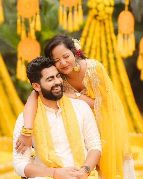 A quiet, candid moment during a Haldi ceremony. My approach to wedding photography is to capture these genuine interactions that tell the real story of your love.