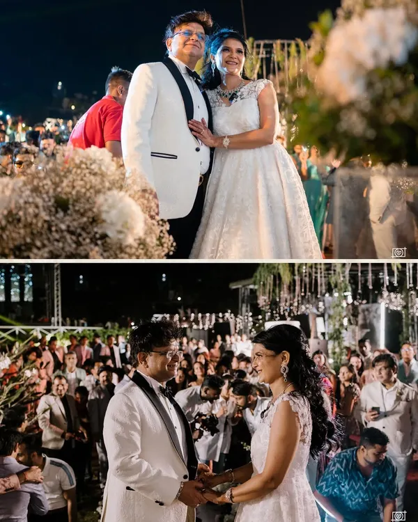A beautiful portrait of the couple during their 25th-anniversary celebration in Goa. Dressed in elegant white, they are surrounded by family and friends, ready to celebrate their incredible journey together.