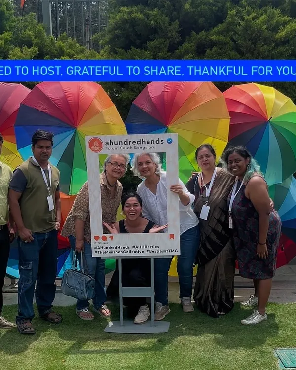 Blessed to host, grateful to share. A moment with our team and visitors at the Monsoon Collective, surrounded by the colourful energy that defines our events.
