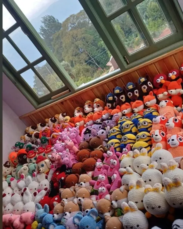 A view of my workshop filled with hundreds of handmade dolls. It takes a lot of hard work and dedication, but seeing them all together is incredibly satisfying.