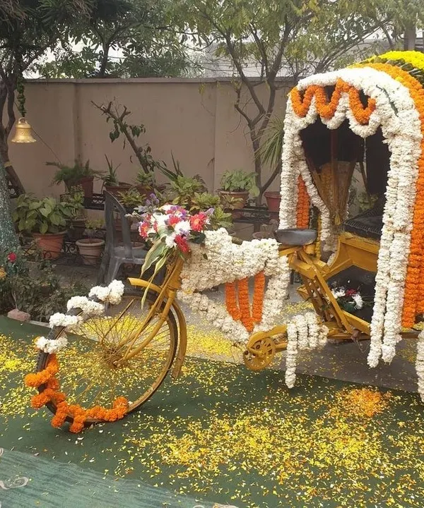 A quirky and fun photo booth concept featuring a cycle rickshaw decorated with marigold and jasmine flowers. This was a huge hit among guests and added a touch of playful nostalgia to the event.