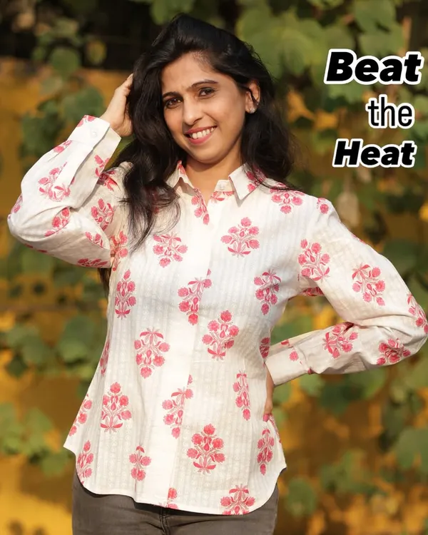 Beat the heat in style with our summer shirts. This one, with its delicate pink print on a striped base, is made from breathable fabric to keep you cool and comfortable.